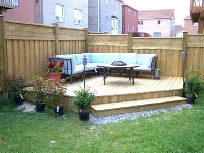 outdoor raised decking to corner of garden